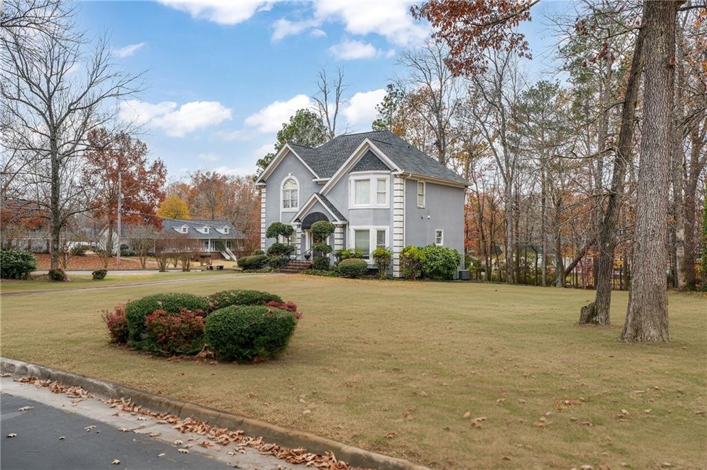224 Rolling Oaks Drive Rome, GA 30165 - Photo 4 of 55 a view of a street with a house in the background