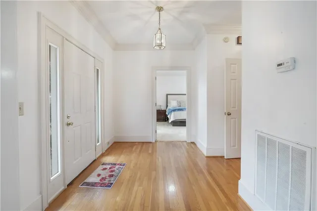 a bedroom with a bed and a mirror