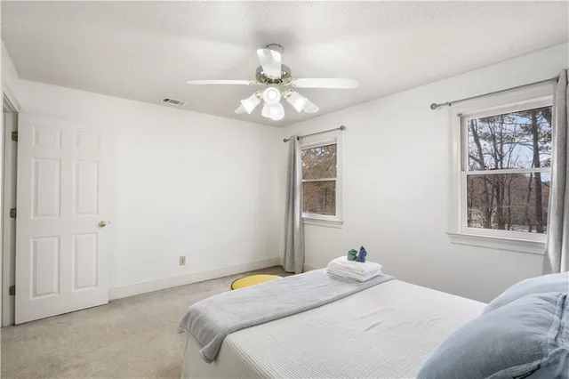 a bedroom with a bed and closet