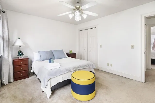 a bedroom with a bed and window