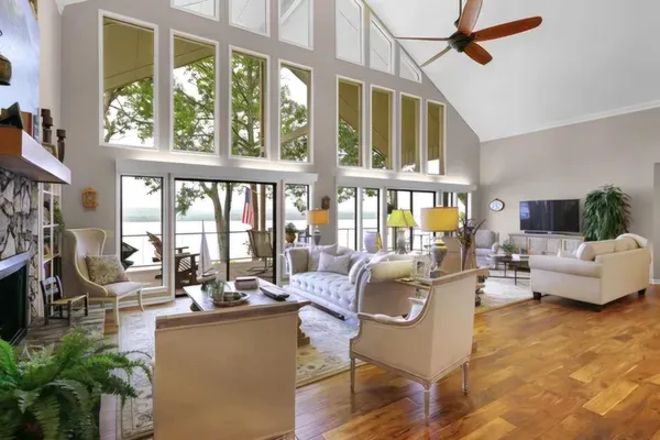 a living room with furniture window and wooden floor