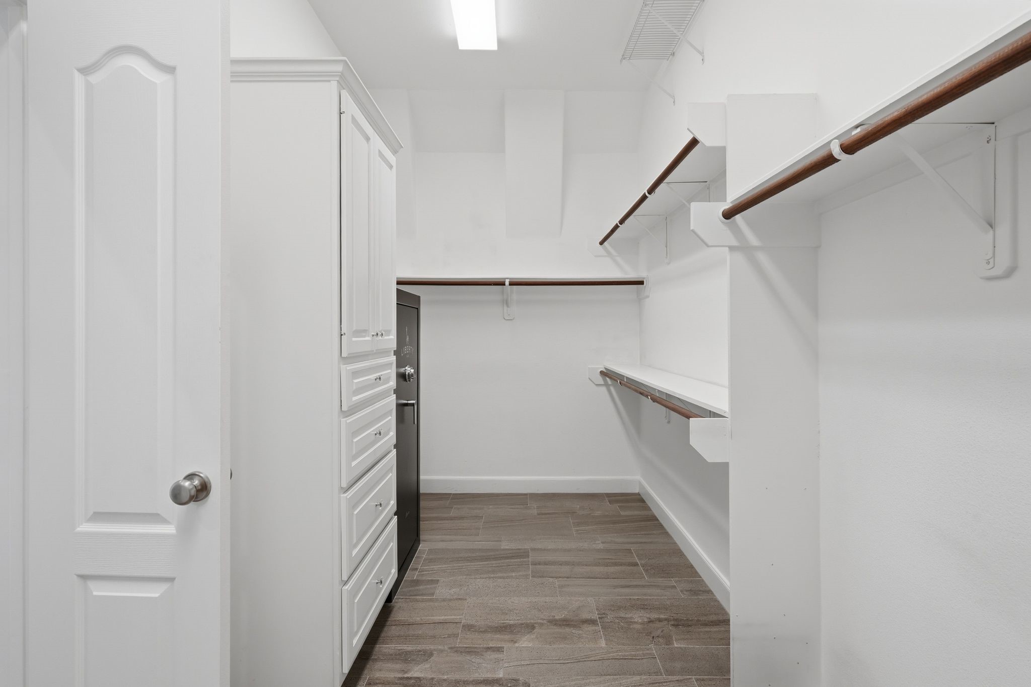 2118 Cias Trail Lane Spring, TX 77386 - Photo 22 of 46 WALK IN CLOSET WITH BUILT INS! Even has an extra rod at the top to utilize every inch of space.