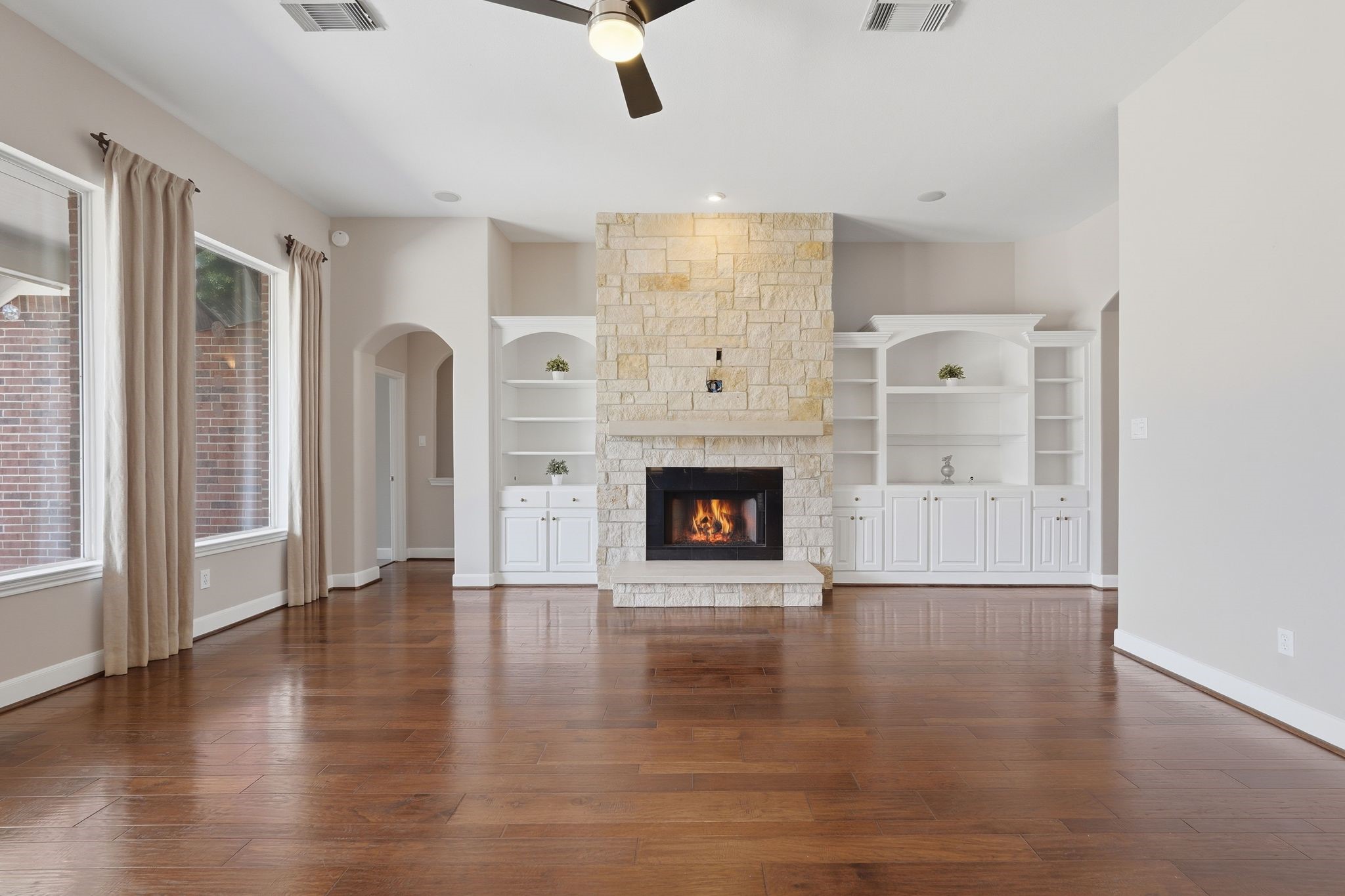 2118 Cias Trail Lane Spring, TX 77386 - Photo 9 of 46 Wall of built ins and a custom stone fireplace with limestone mantle & hearth really complete this living room!