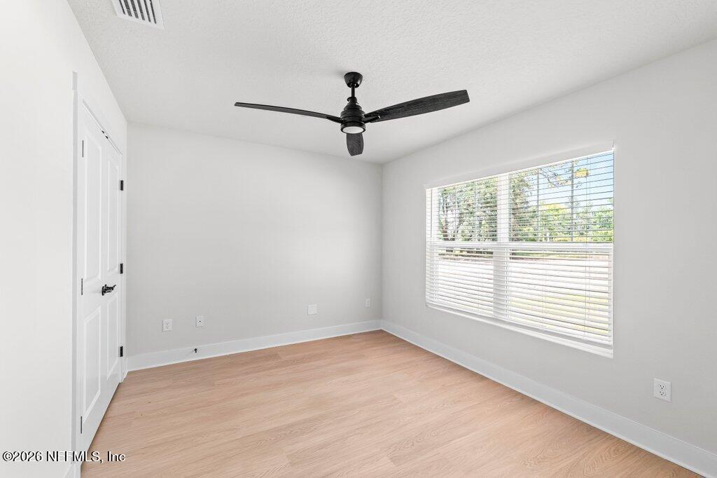 9680 Taylor Field Road Jacksonville, FL 32222 - Photo 15 of 27 a view of a room with a window and a ceiling fan