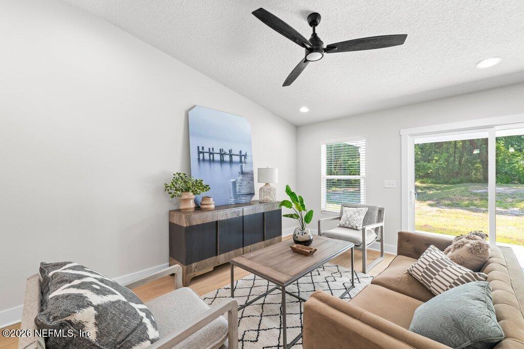 9680 Taylor Field Road Jacksonville, FL 32222 - Photo 18 of 27 a living room with furniture