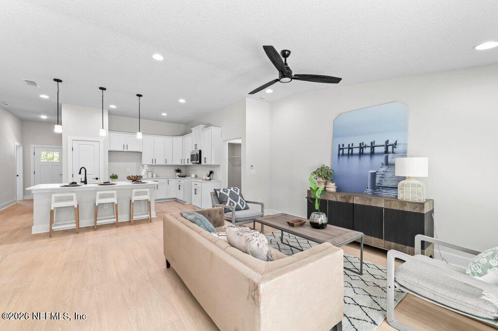 9680 Taylor Field Road Jacksonville, FL 32222 - Photo 20 of 27 a kitchen with a sink stove and cabinets