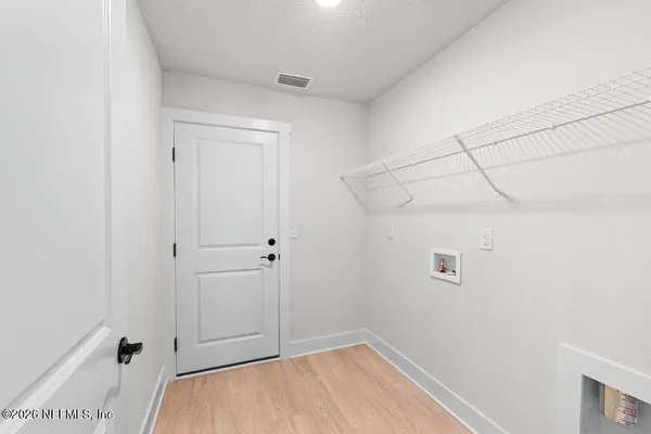 a view of a room with racks on the wall