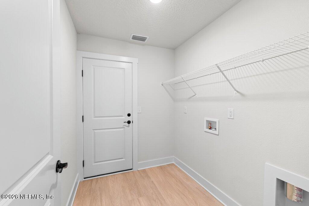 9680 Taylor Field Road Jacksonville, FL 32222 - Photo 25 of 27 a view of a room with racks on the wall