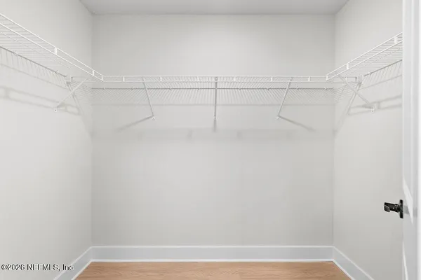 a view of a room with racks on the wall