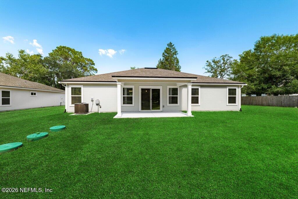 9680 Taylor Field Road Jacksonville, FL 32222 - Photo 6 of 27 a front view of house with a garden