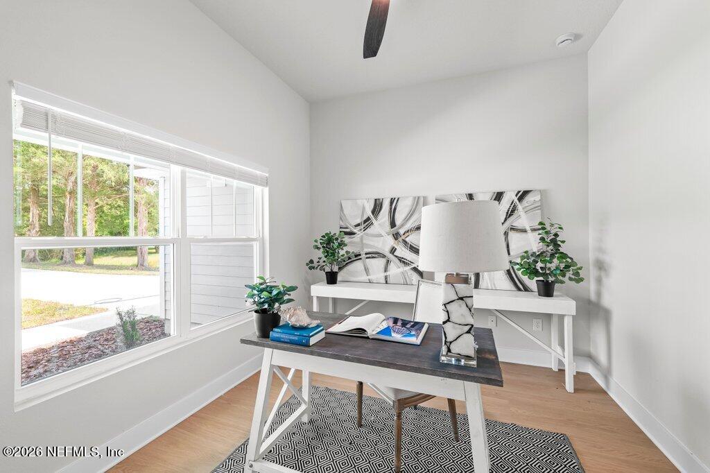 9680 Taylor Field Road Jacksonville, FL 32222 - Photo 9 of 27 a living room with furniture and a potted plant