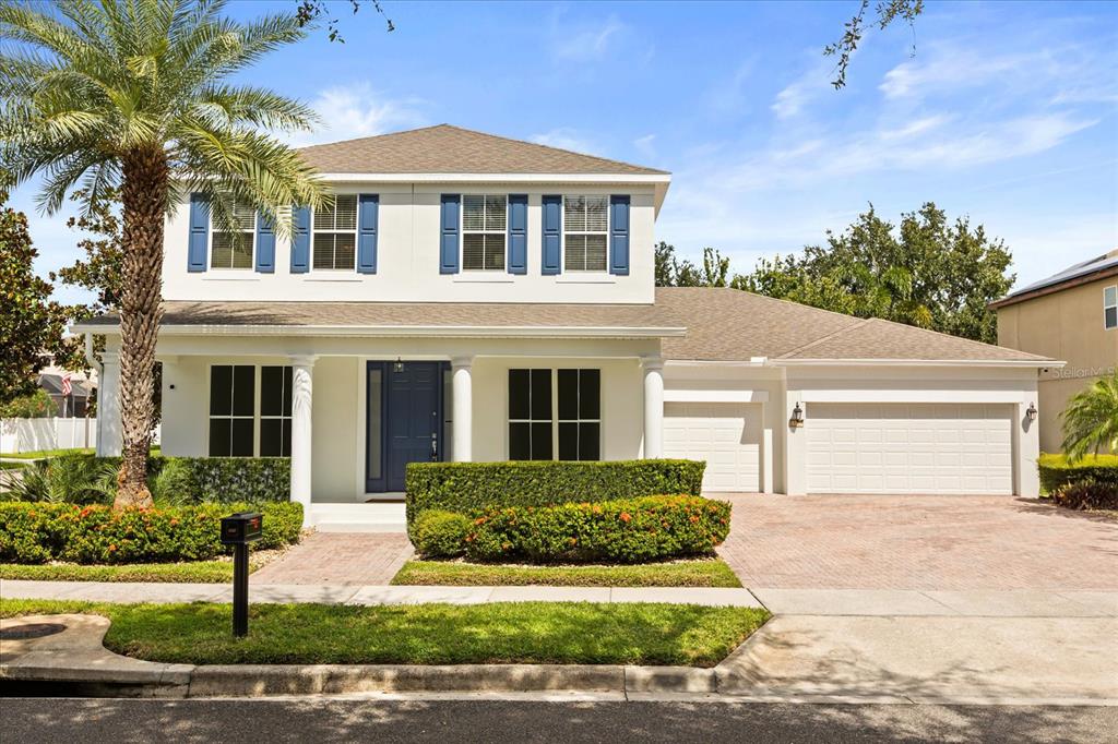 13327 Fernow Street Windermere, FL 34786 - Photo 1 of 1 a front view of a house with a yard and garage