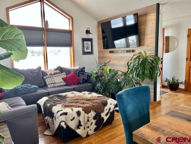 64130 Peach Valley Road Crawford, CO 81415 - Photo 12 of 33 a bedroom with a balcony a bed and a couch