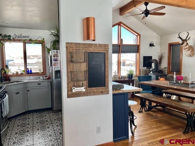 64130 Peach Valley Road Crawford, CO 81415 - Photo 13 of 33 a room with kitchen island granite countertop furniture and a fireplace
