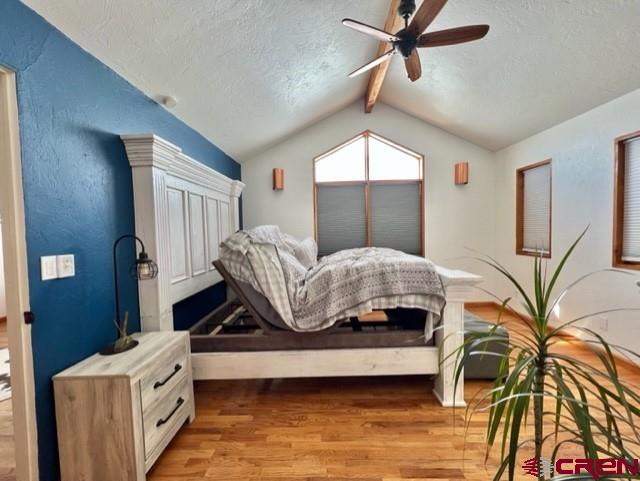 64130 Peach Valley Road Crawford, CO 81415 - Photo 15 of 33 a living room with furniture and a chandelier