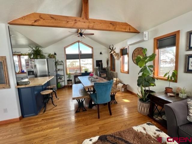 64130 Peach Valley Road Crawford, CO 81415 - Photo 2 of 33 a living room with furniture a window and wooden floor
