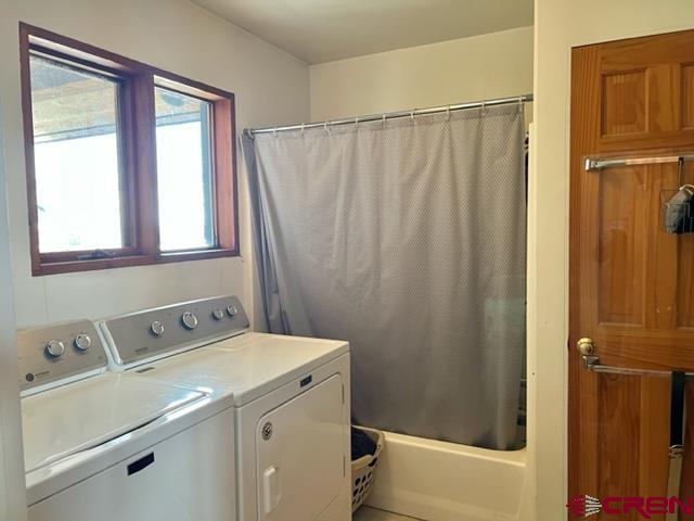 64130 Peach Valley Road Crawford, CO 81415 - Photo 22 of 33 a bathroom with a sink a toilet and a shower