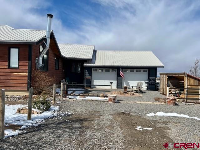 64130 Peach Valley Road Crawford, CO 81415 - Photo 28 of 33 a front view of a house with sitting area