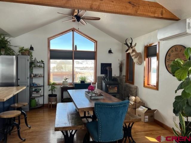 64130 Peach Valley Road Crawford, CO 81415 - Photo 3 of 33 a dining room with furniture a chandelier and wooden floor