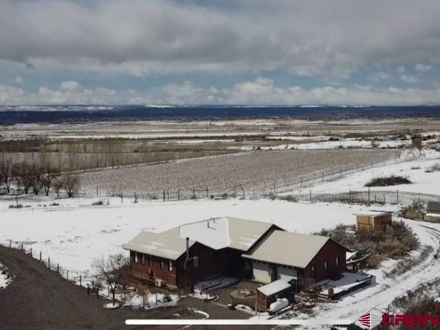 64130 Peach Valley Road Crawford, CO 81415 - Photo 33 of 33 a view of a lake with a car parked