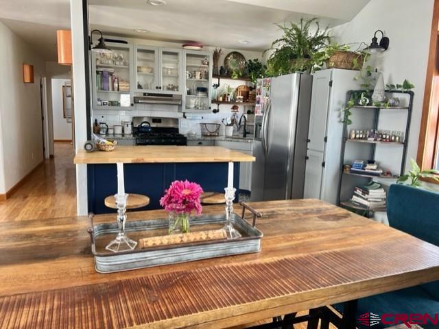 64130 Peach Valley Road Crawford, CO 81415 - Photo 9 of 33 a kitchen with refrigerator and cabinets