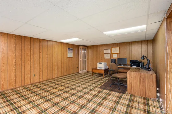 a bed room with a bed and a chair