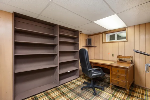 a view of a workspace with furniture