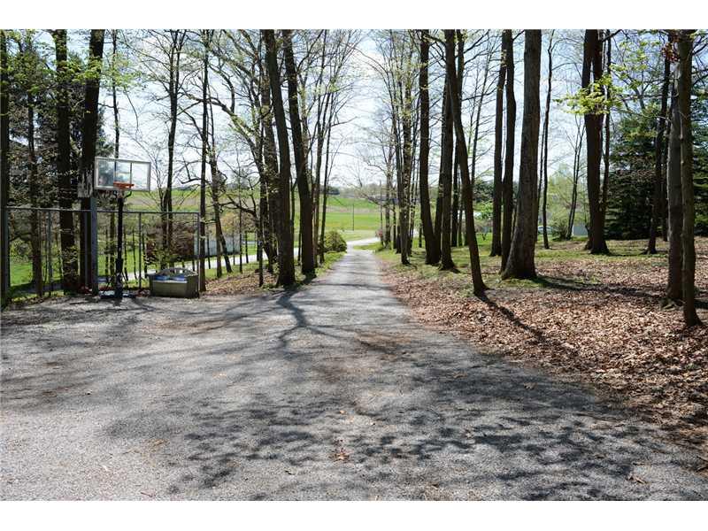 146 Creek Road Dayton, PA 16222 - Photo 17 of 17 Parking Lot/Garage. The wooded driveway makes for a picturesque entrance to the home.