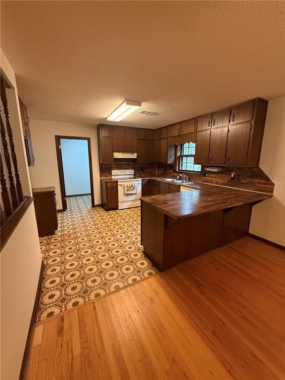 1565 Shoal Creek Road Cleveland, GA 30528 - Photo 22 of 38 a kitchen with stainless steel appliances granite countertop a sink dishwasher stove and refrigerator