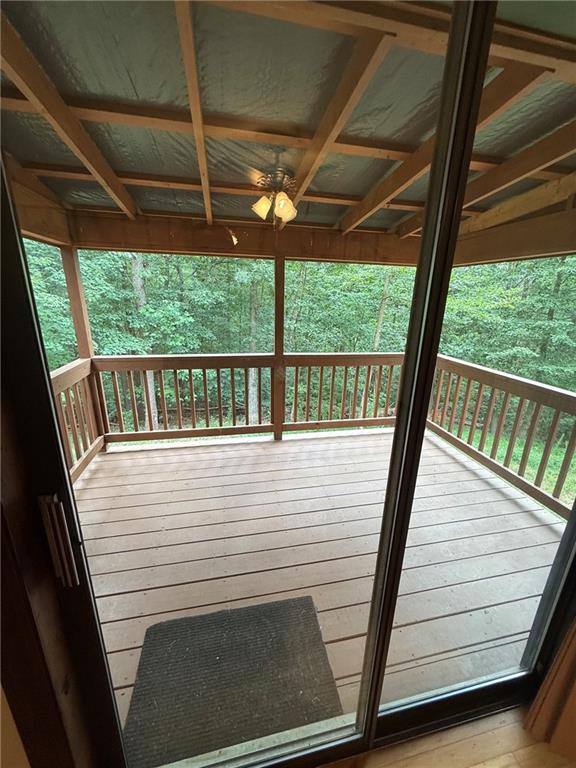 1565 Shoal Creek Road Cleveland, GA 30528 - Photo 23 of 38 a view of a deck with a table and chair with wooden floor