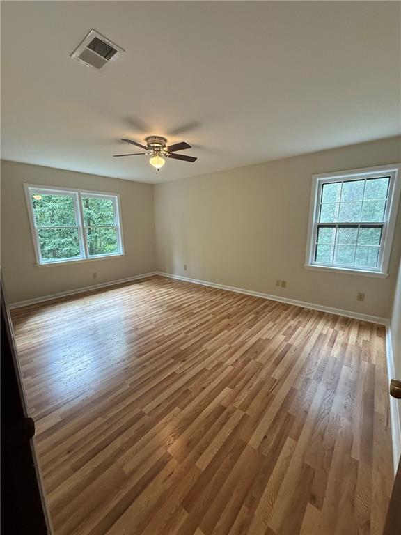 1565 Shoal Creek Road Cleveland, GA 30528 - Photo 27 of 38 wooden floor in an empty room with a window