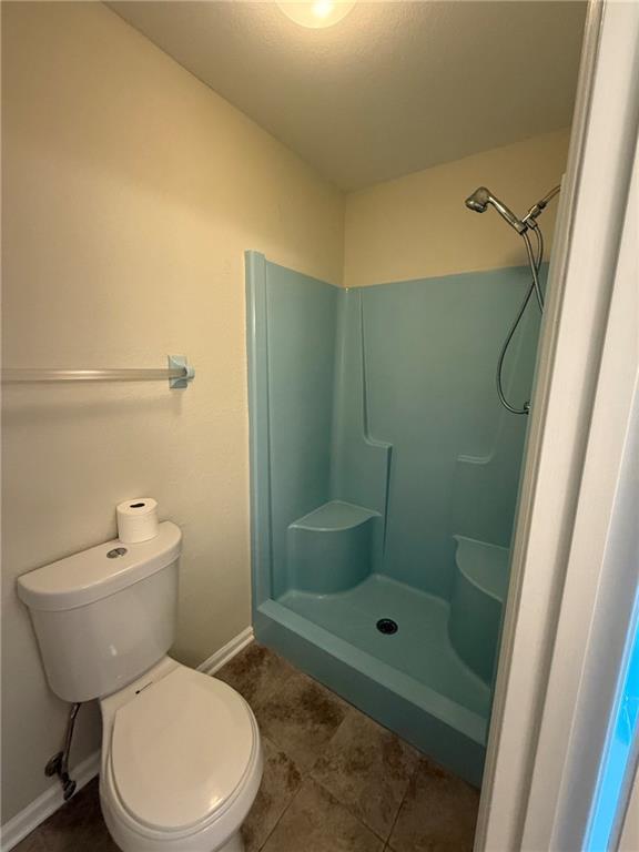 1565 Shoal Creek Road Cleveland, GA 30528 - Photo 29 of 38 a bathroom with a toilet and a shower