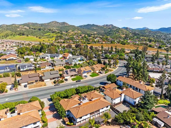 an aerial view of residential houses with outdoor space