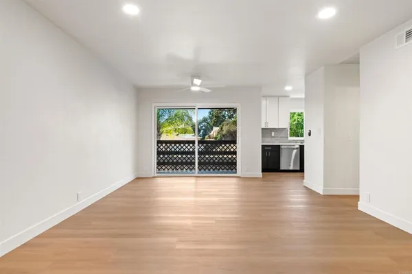 a view of an empty room with a window