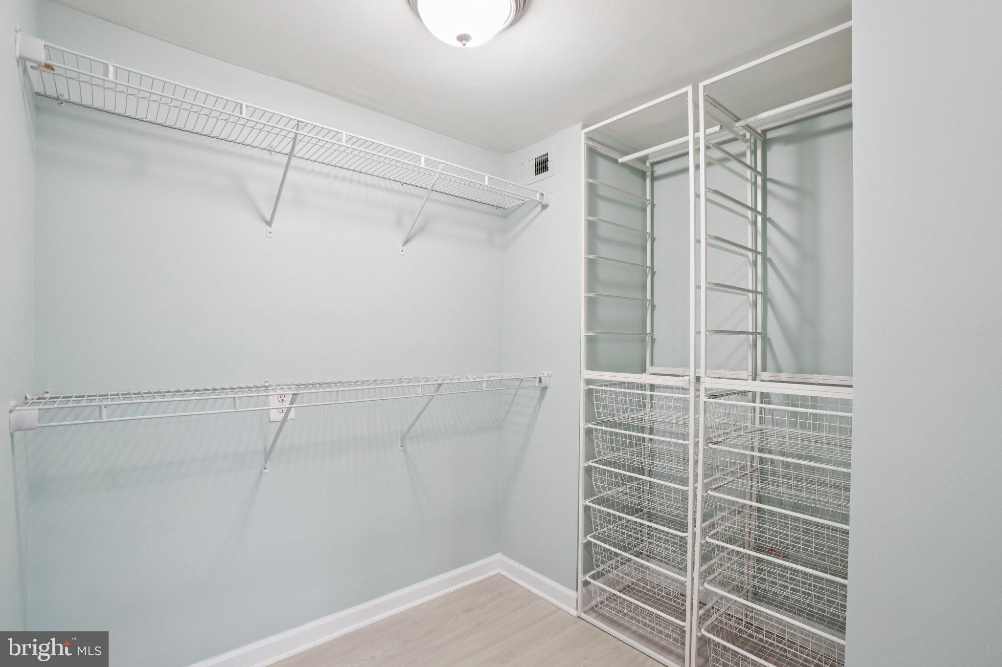 1515 South Arlington Ridge Road, Unit 603 Arlington, VA 22202 - Photo 16 of 39 a view of walk in closet with empty racks