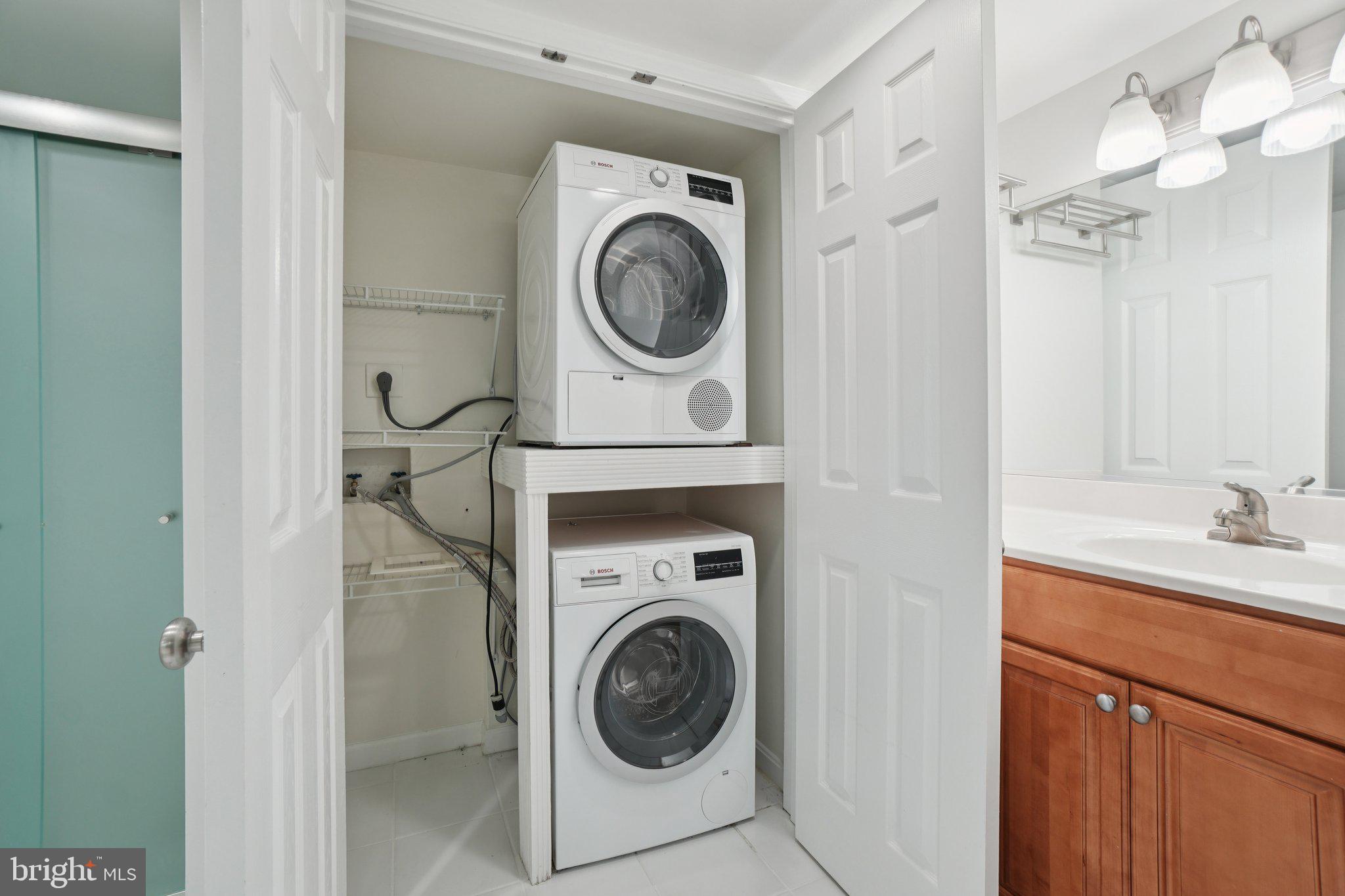 1515 South Arlington Ridge Road, Unit 603 Arlington, VA 22202 - Photo 21 of 39 a utility room with sink dryer and washer