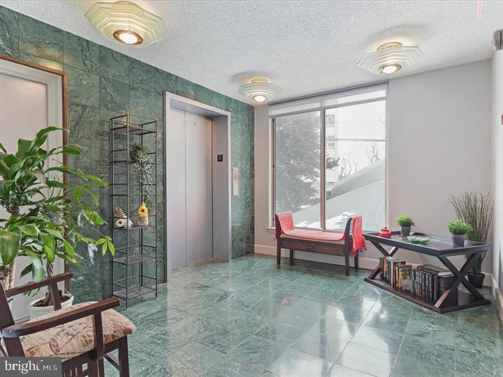 1515 South Arlington Ridge Road, Unit 603 Arlington, VA 22202 - Photo 30 of 39 a living room with furniture and a large window