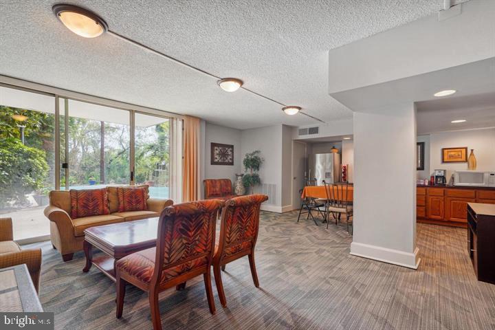 1515 South Arlington Ridge Road, Unit 603 Arlington, VA 22202 - Photo 33 of 39 a living room with furniture and a wooden floor
