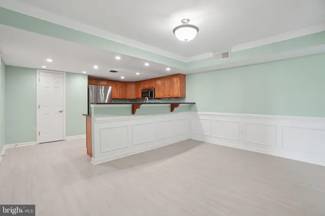 a view of kitchen with wooden floor