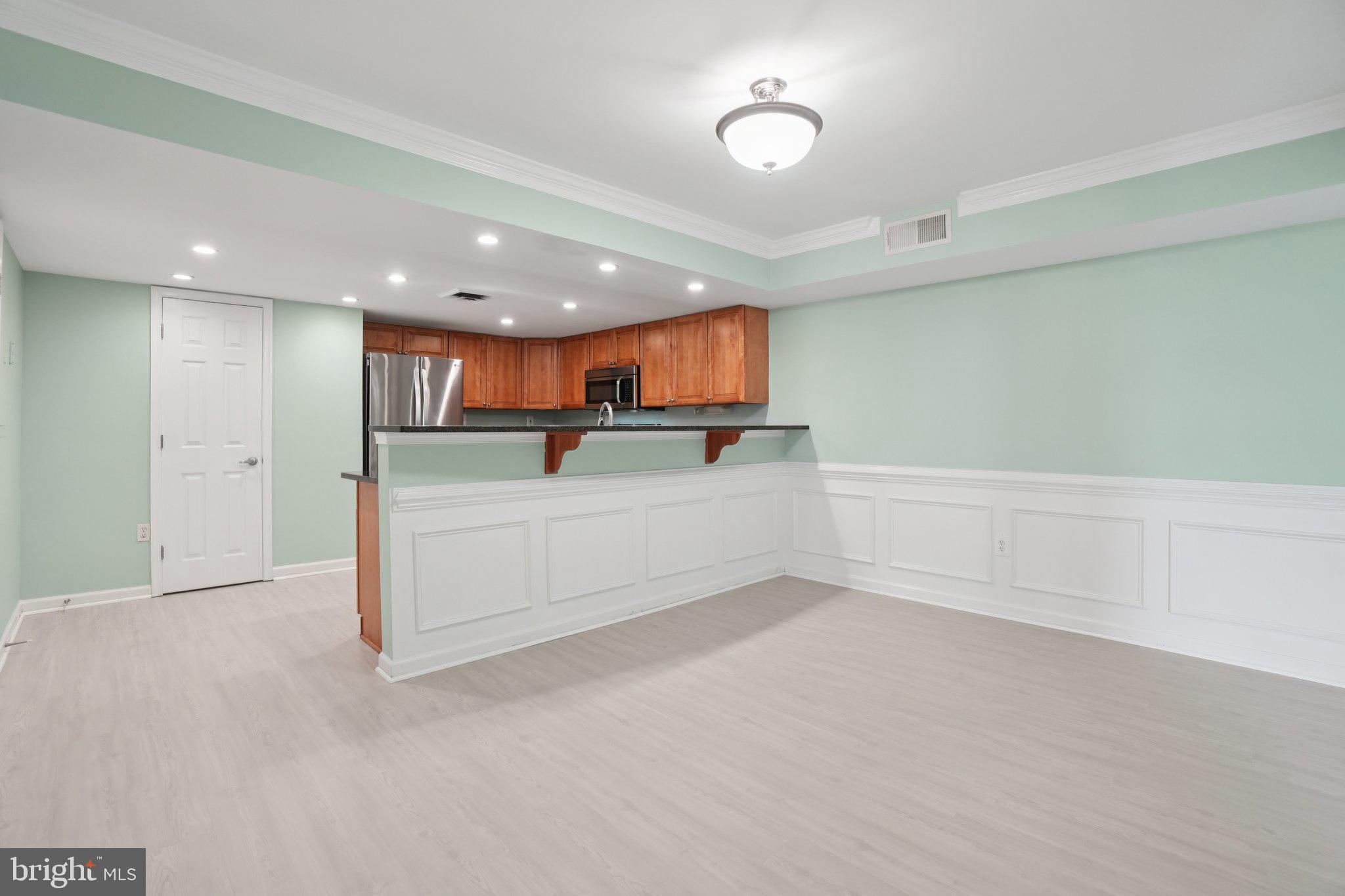 1515 South Arlington Ridge Road, Unit 603 Arlington, VA 22202 - Photo 5 of 39 a view of kitchen with wooden floor