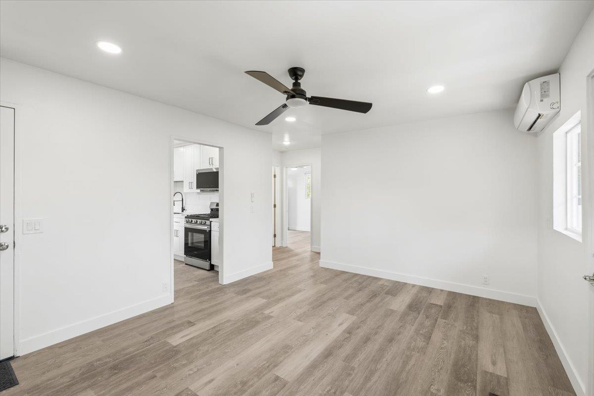 209 Dewitt Court Sacramento, CA 95838 - Photo 11 of 25 unfurnished living room featuring light wood-style floors (LVP), recessed lighting, and ceiling fan