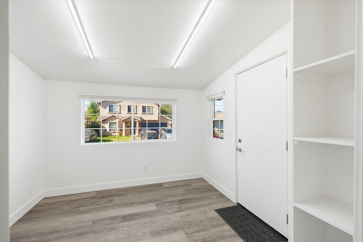 209 Dewitt Court Sacramento, CA 95838 - Photo 16 of 25 deck entrance featuring light wood-type flooring and baseboards