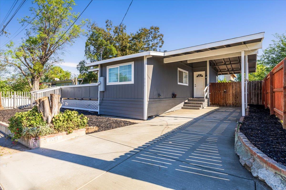 209 Dewitt Court Sacramento, CA 95838 - Photo 2 of 25 view of front facade with an attached carport and driveway