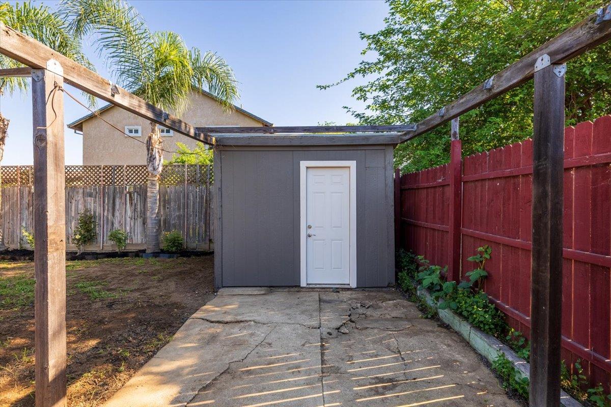209 Dewitt Court Sacramento, CA 95838 - Photo 6 of 25 view of shed with a fenced backyard