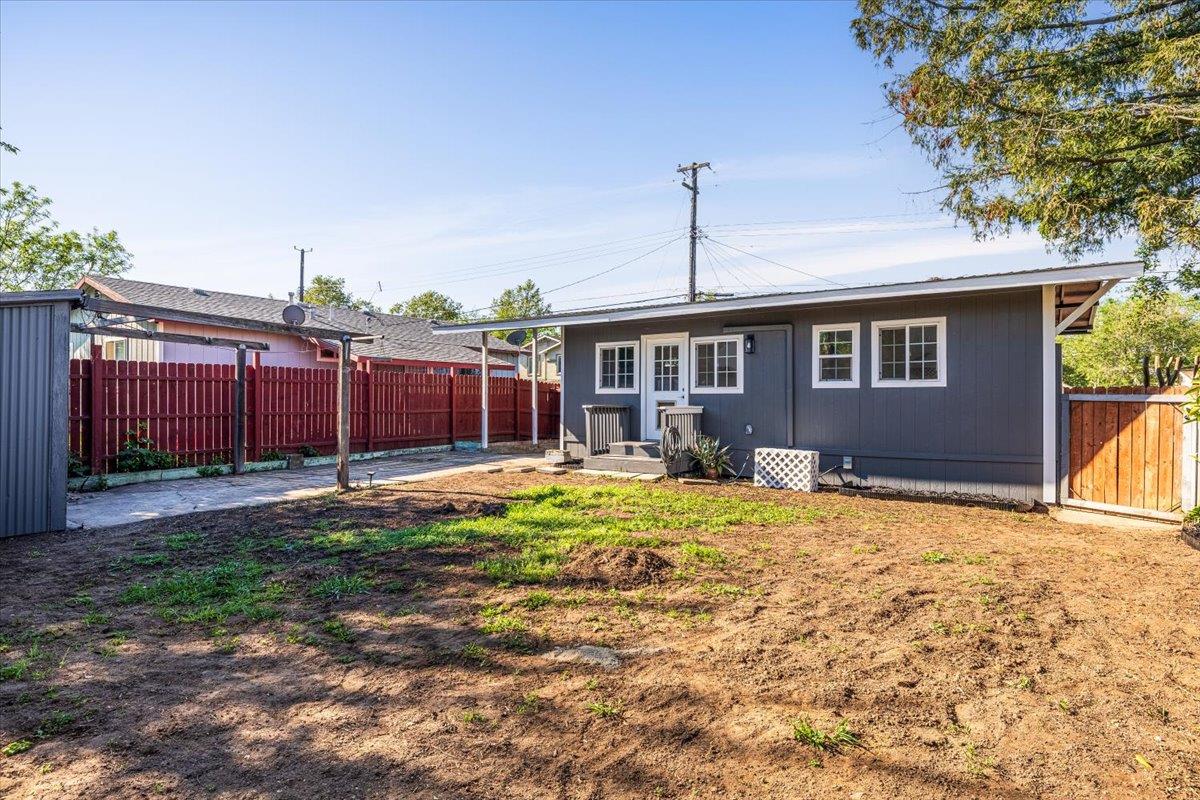 209 Dewitt Court Sacramento, CA 95838 - Photo 8 of 25 back of property with a fenced backyard and dog run