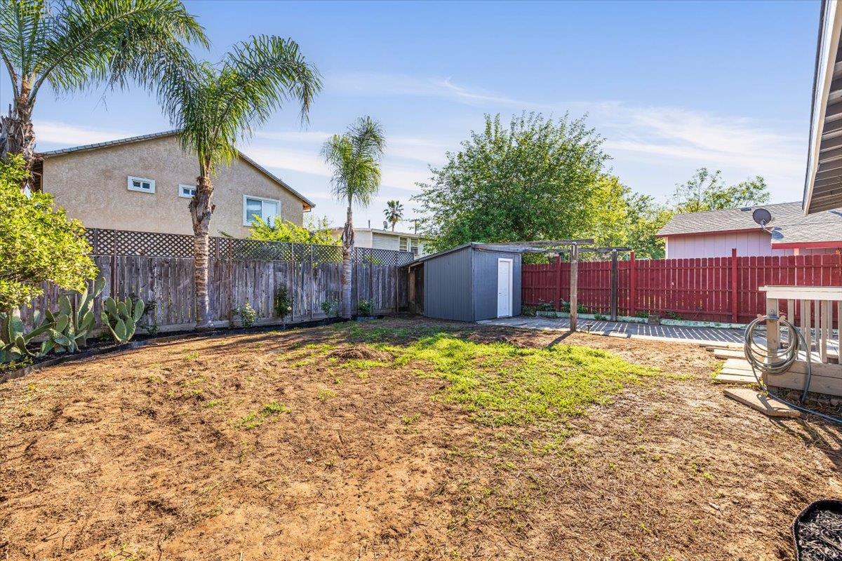 209 Dewitt Court Sacramento, CA 95838 - Photo 9 of 25 fenced backyard with a storage shed
