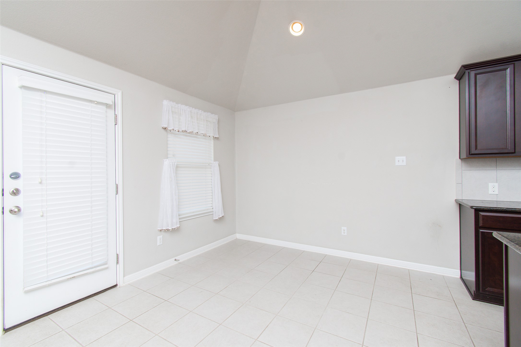 136 Mistflower Lane Kyle, TX 78640 - Photo 7 of 20 a view of an empty room with a fireplace and a window
