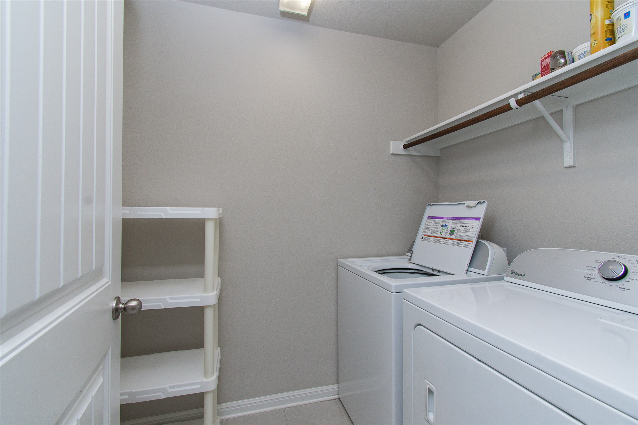 136 Mistflower Lane Kyle, TX 78640 - Photo 8 of 20 a storage room with washer and dryer