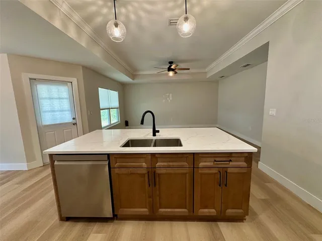 a view of a room with a sink and mirror