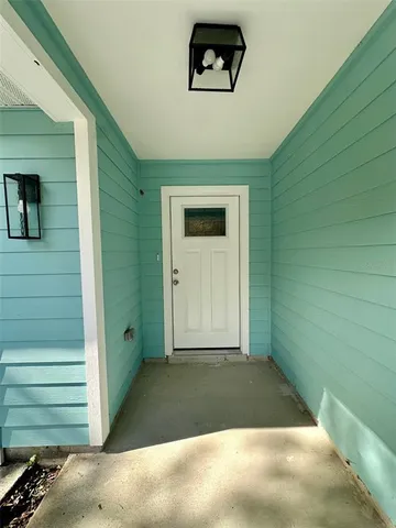 a view of a door and a window